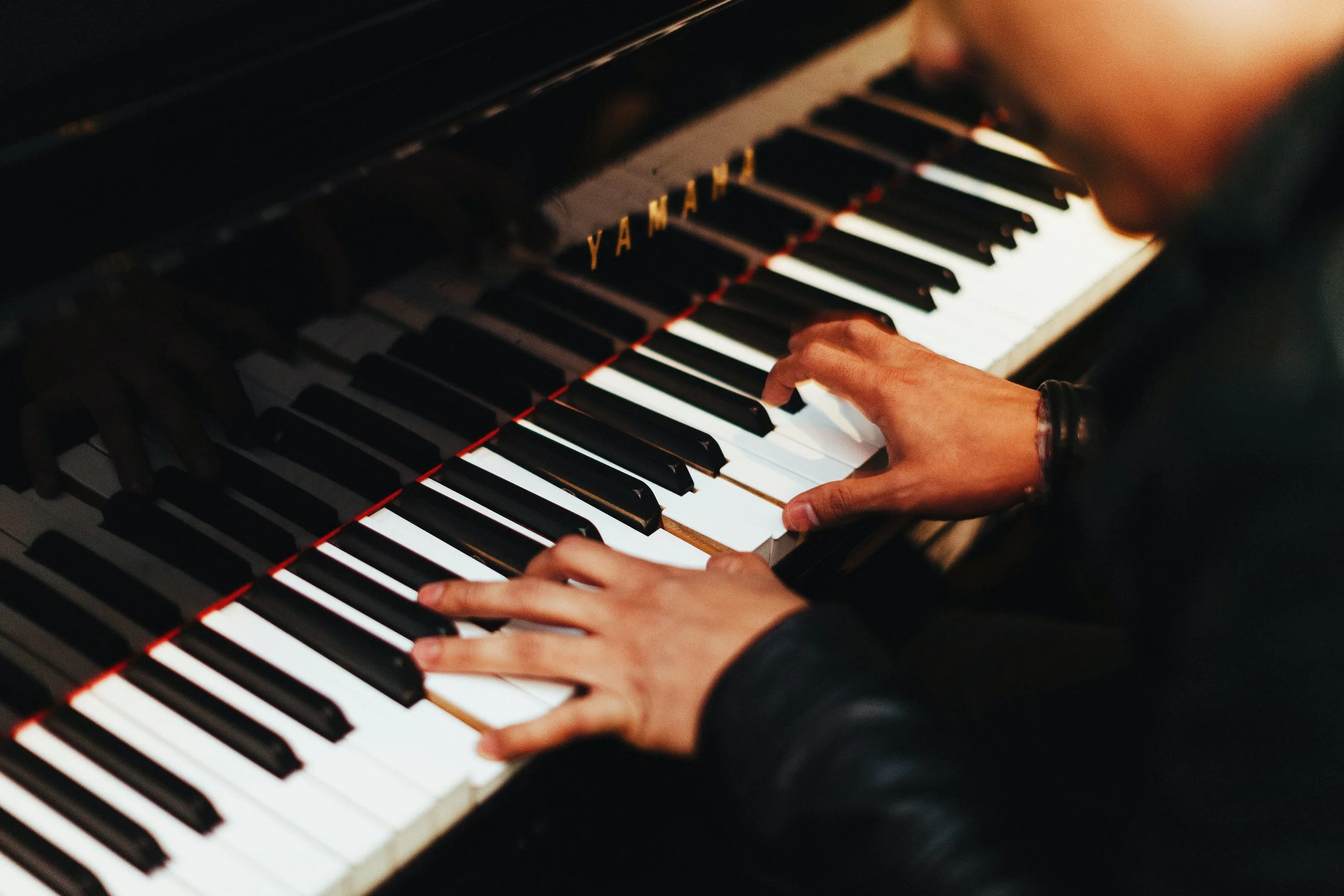 Hands playing piano